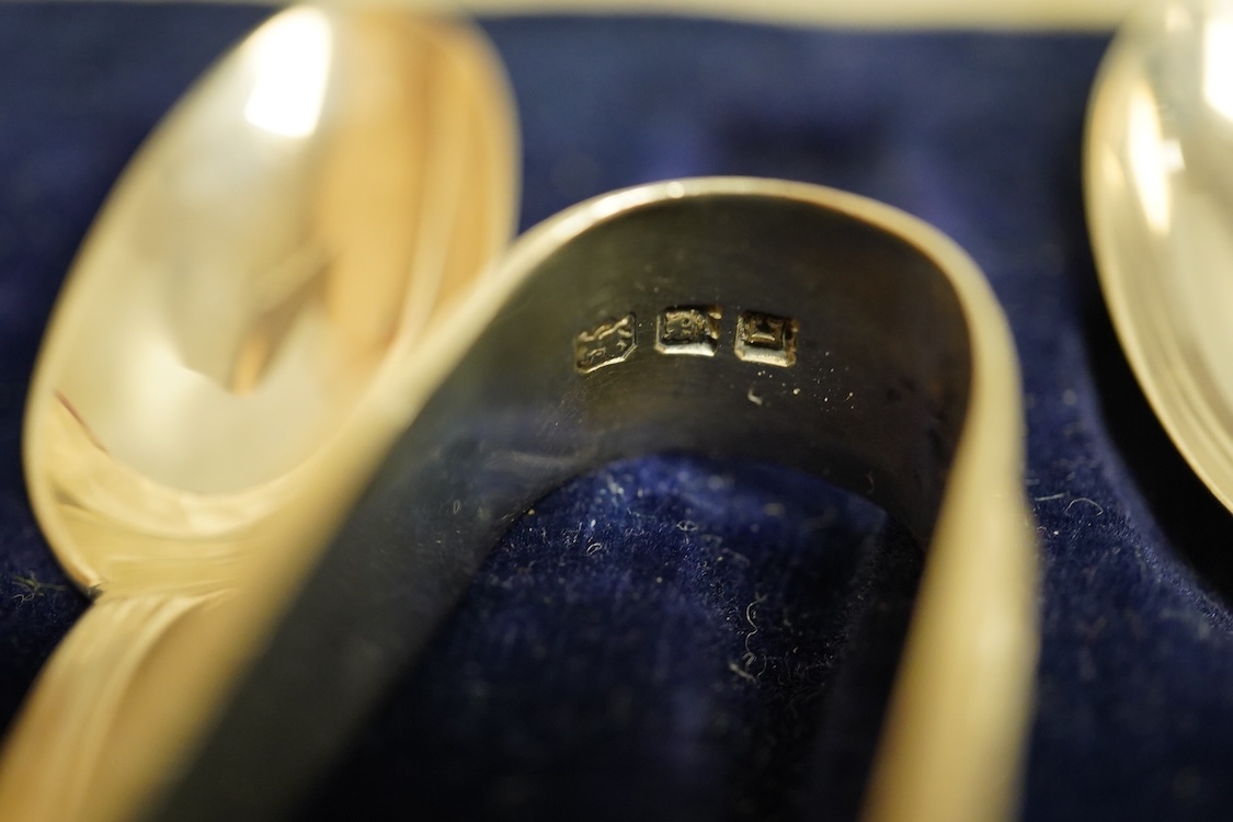 A cased set of five(ex 6) silver teaspoons and pair of sugar tongs, a set of six shell end coffee spoons, five other silver items of flatware, a boxed set of six 830 standard white metal teaspoons, an 800 standard shovel